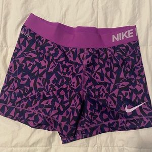 Purple patterned Nike Pros size small.